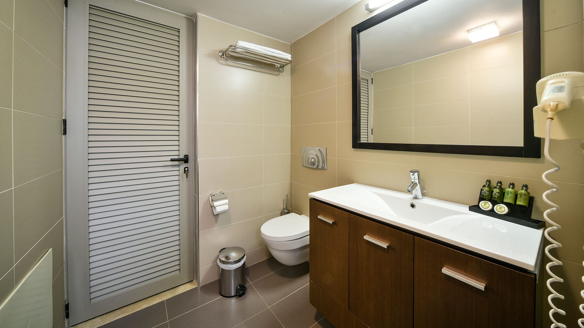 a bathroom with a mirror and sink