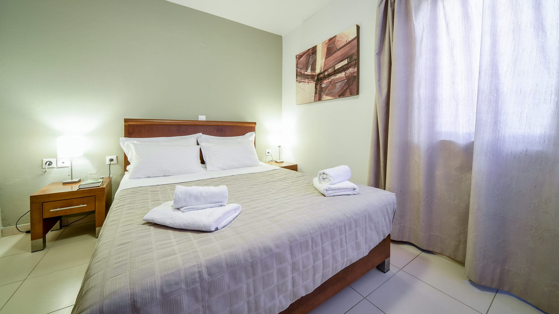 a bed with white towels on it