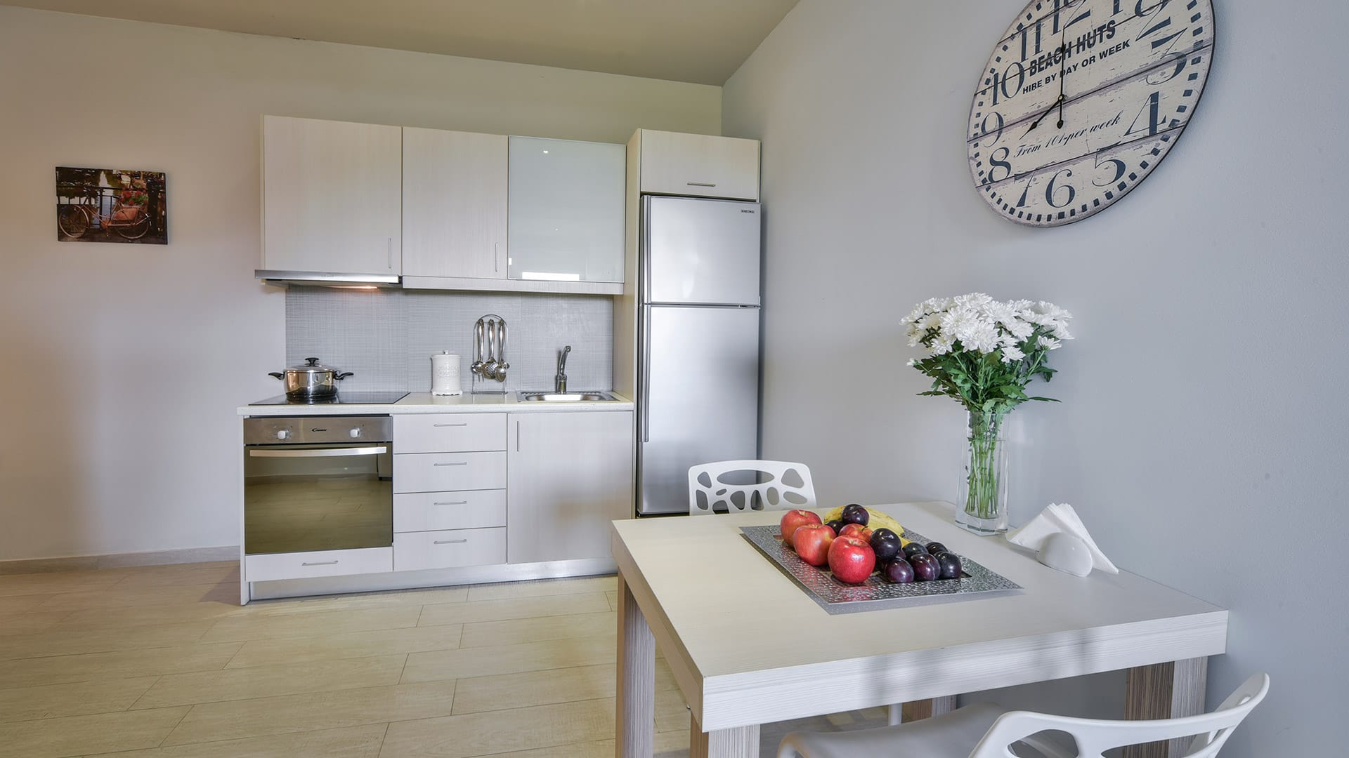 a kitchen with white cabinets