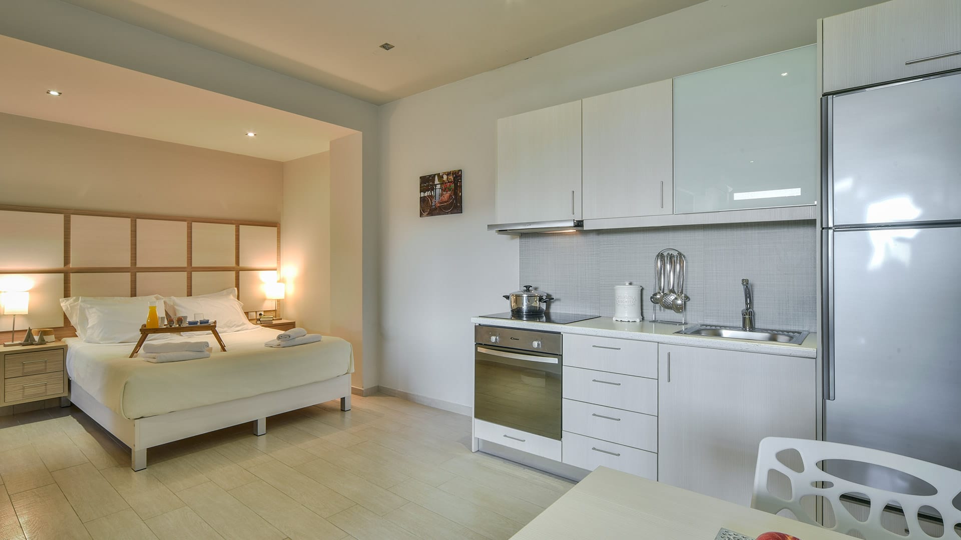 a large kitchen with white cabinets