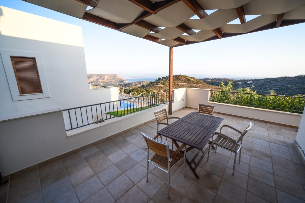 a table and chairs on a deck