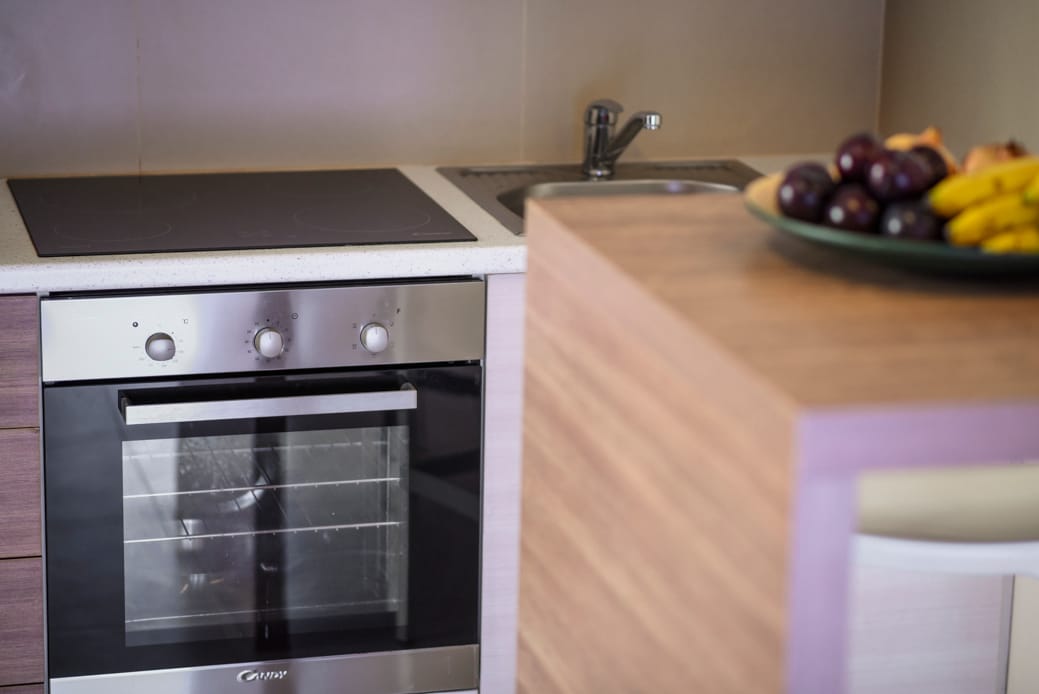 a kitchen with a bowl of fruit