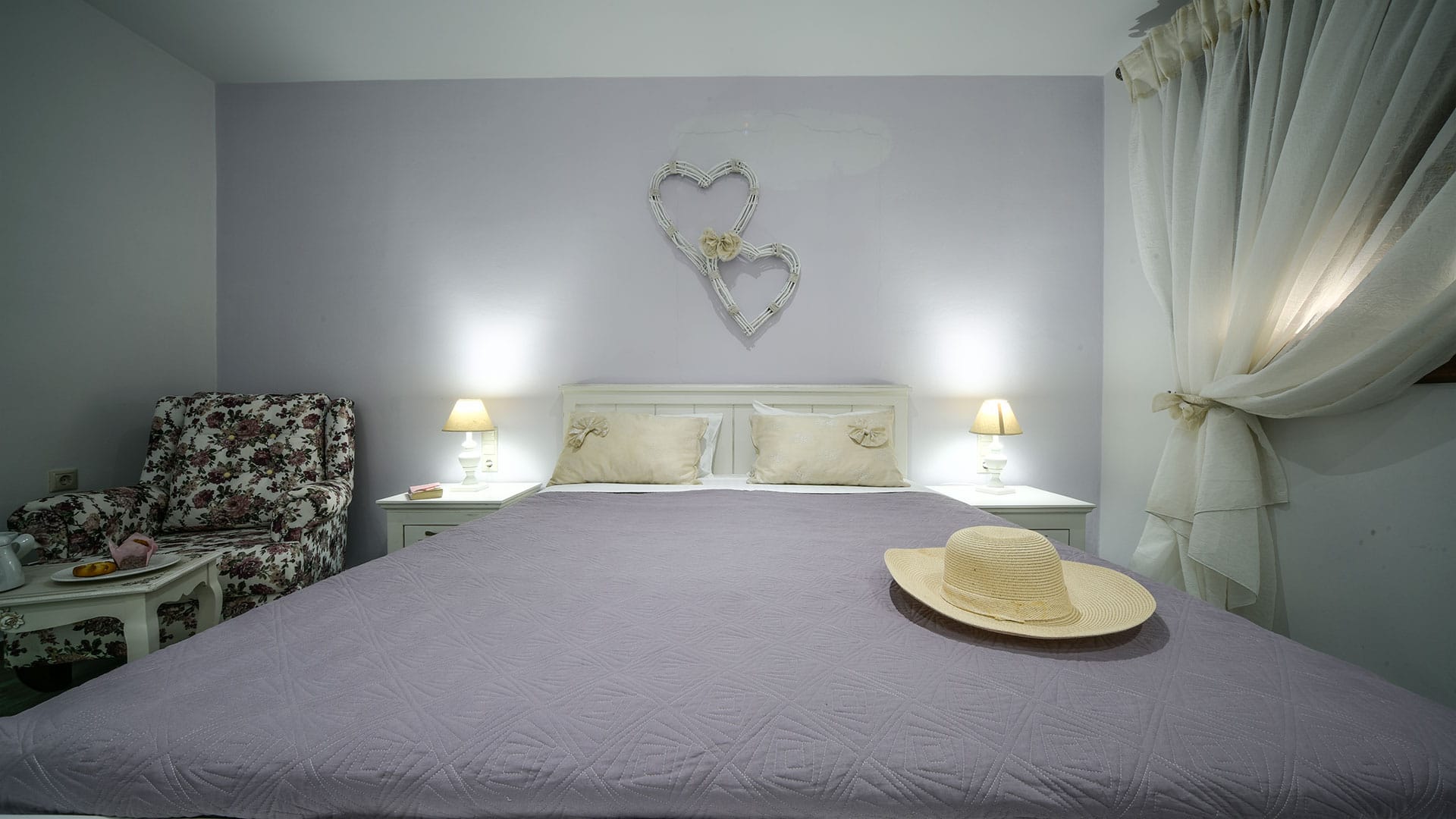 a bedroom with a bed and a chair