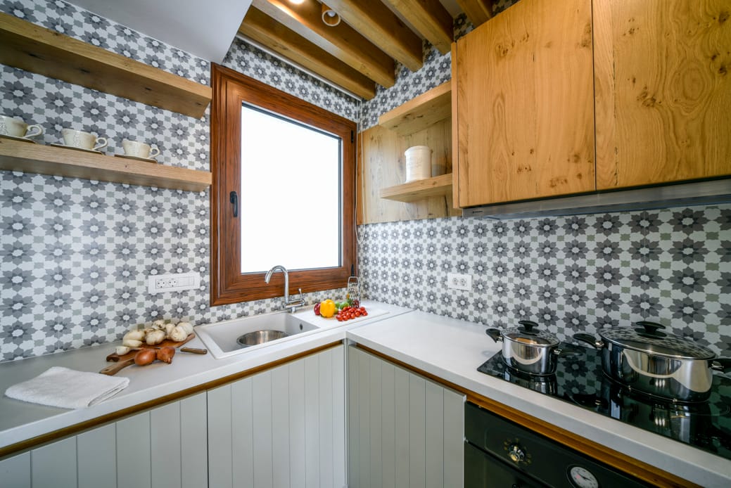 a kitchen with a stove and a sink