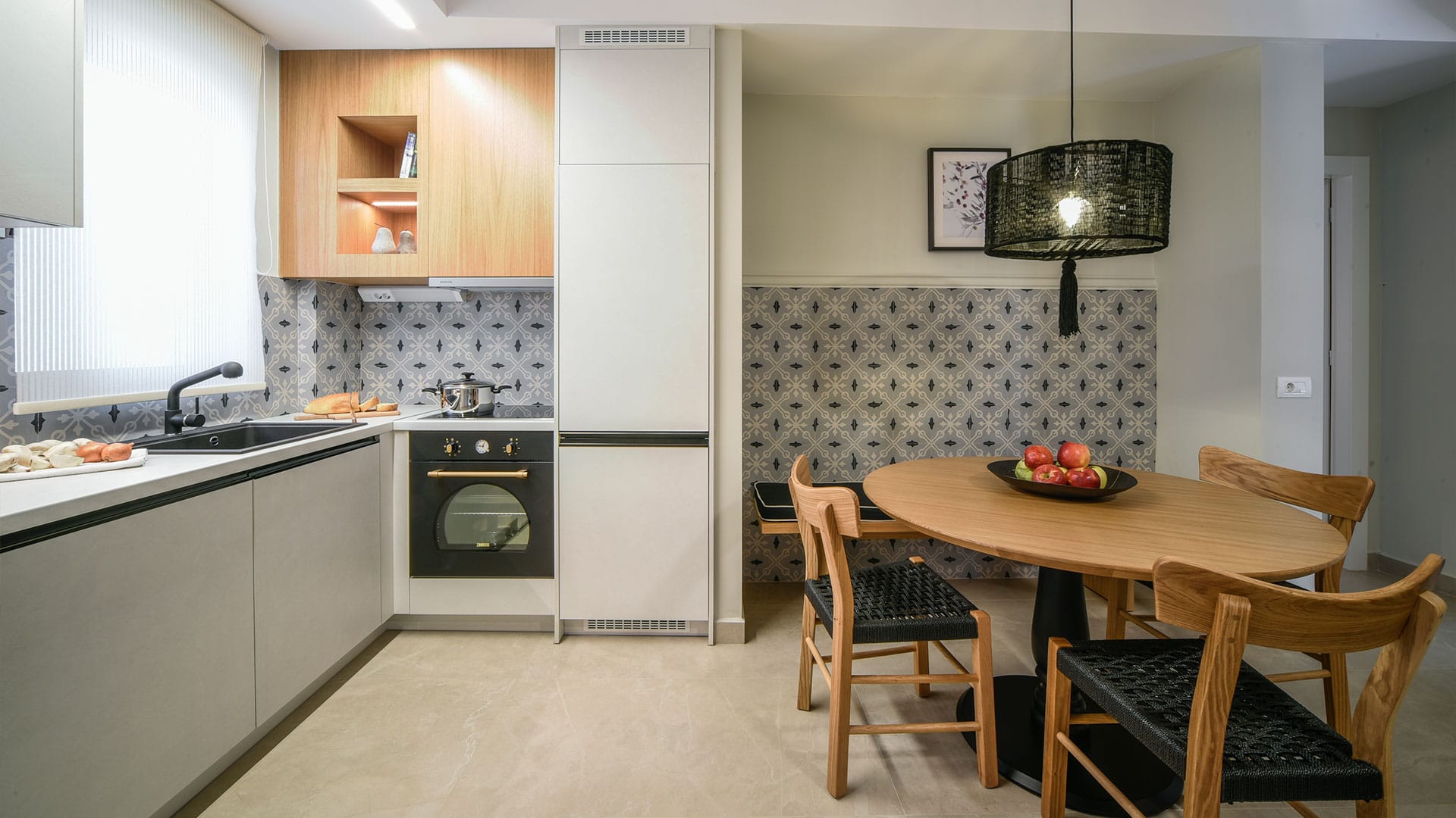 a kitchen with a table and chairs