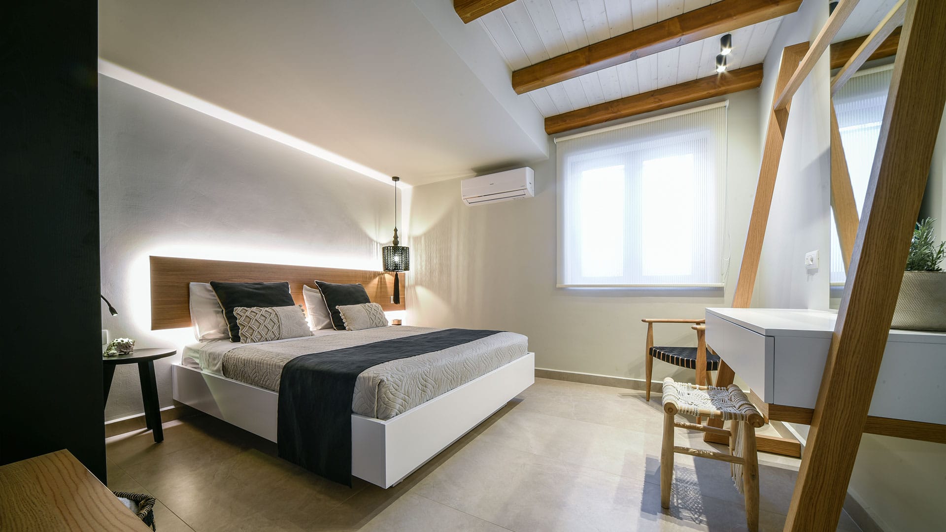 a bedroom with a bed and a table