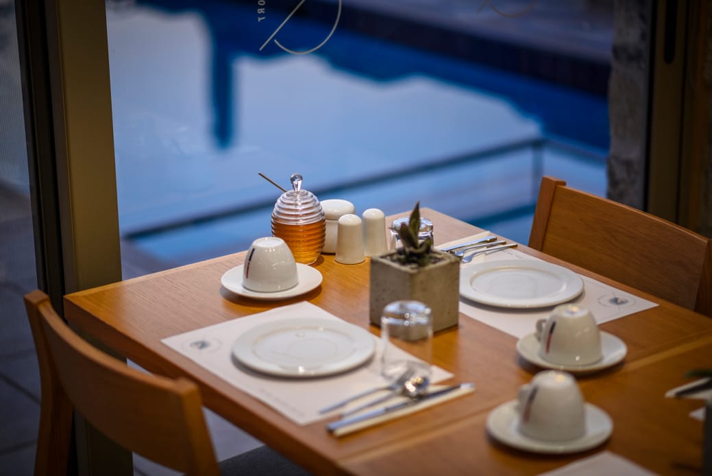 a table with plates and cups on it
