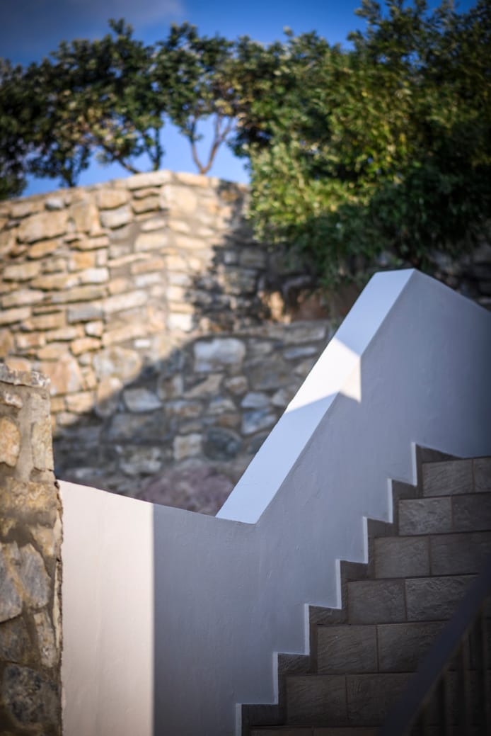 a stone wall with a stone staircase