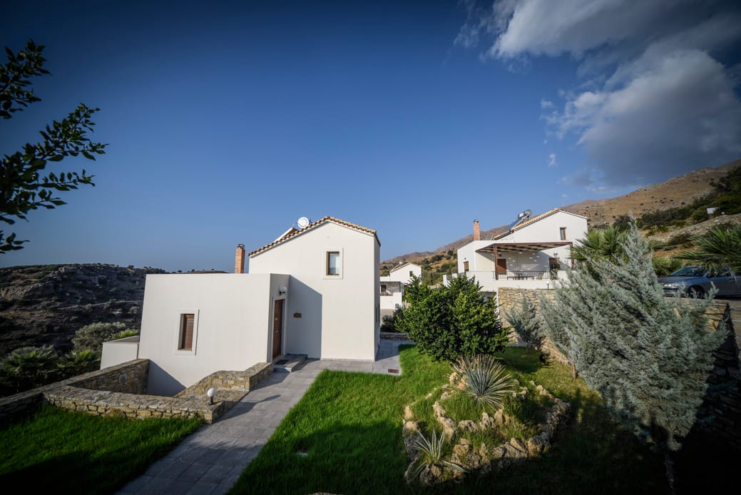 a group of white buildings on a hill