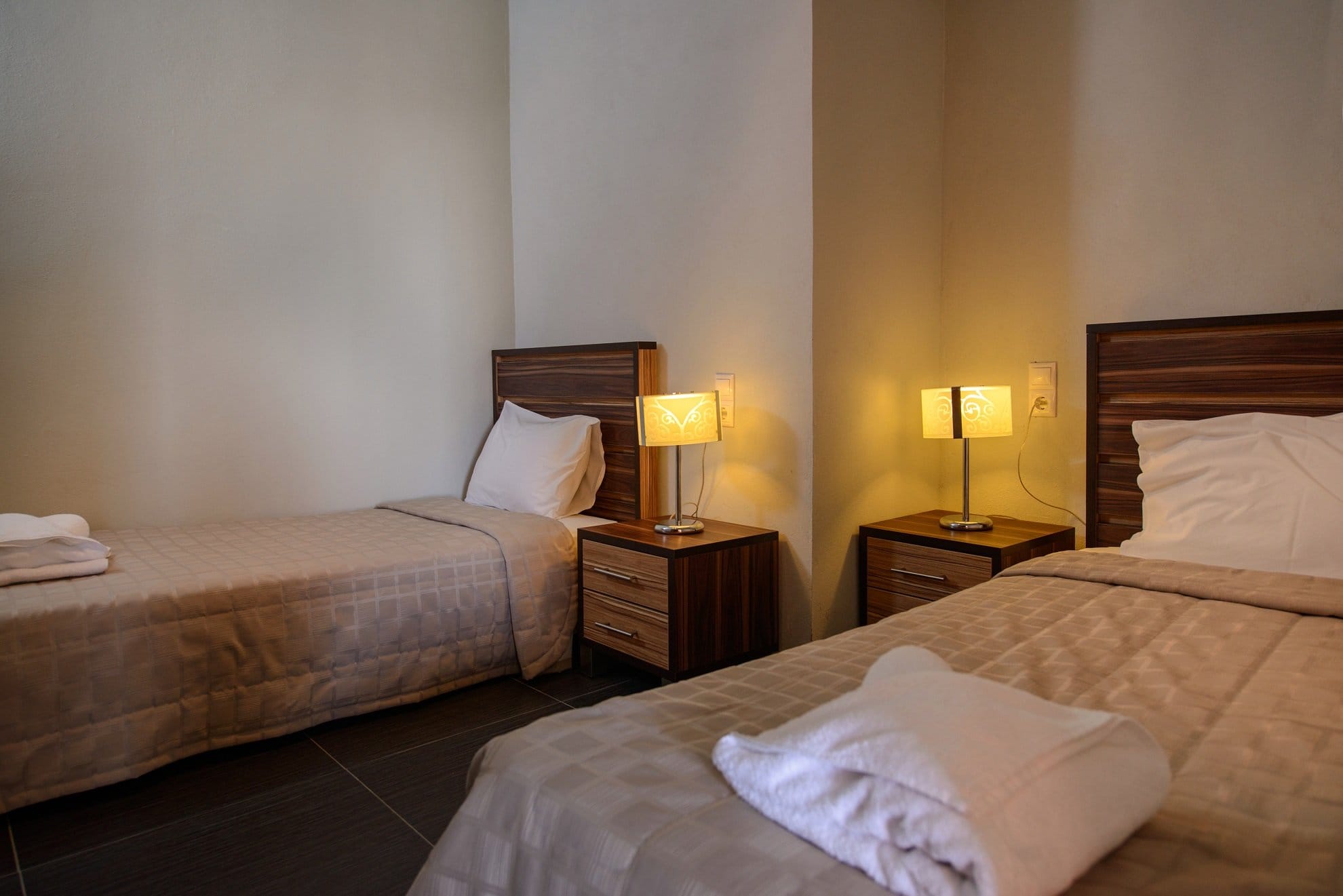 a hotel room with two beds