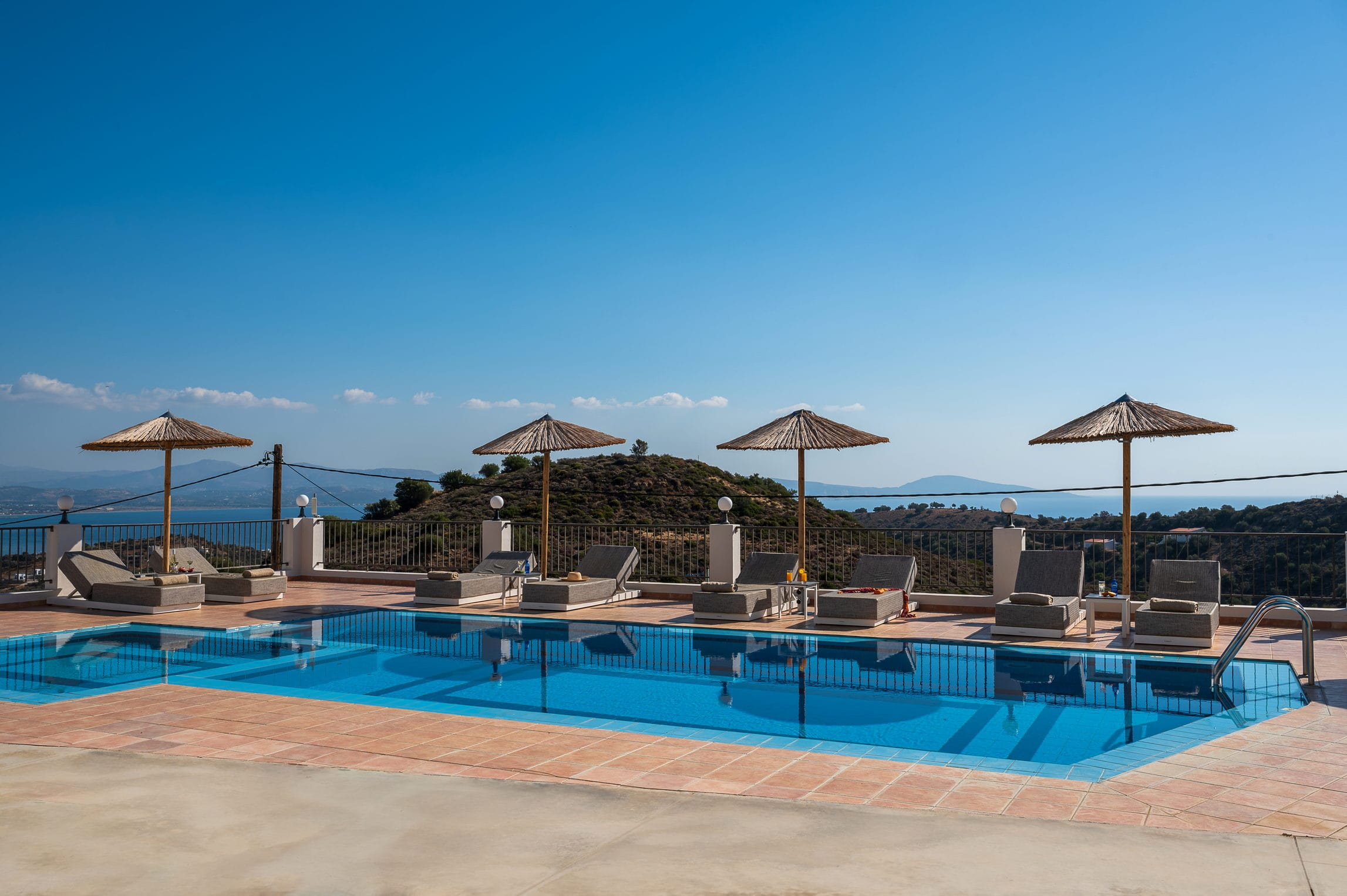 a pool with umbrellas by it