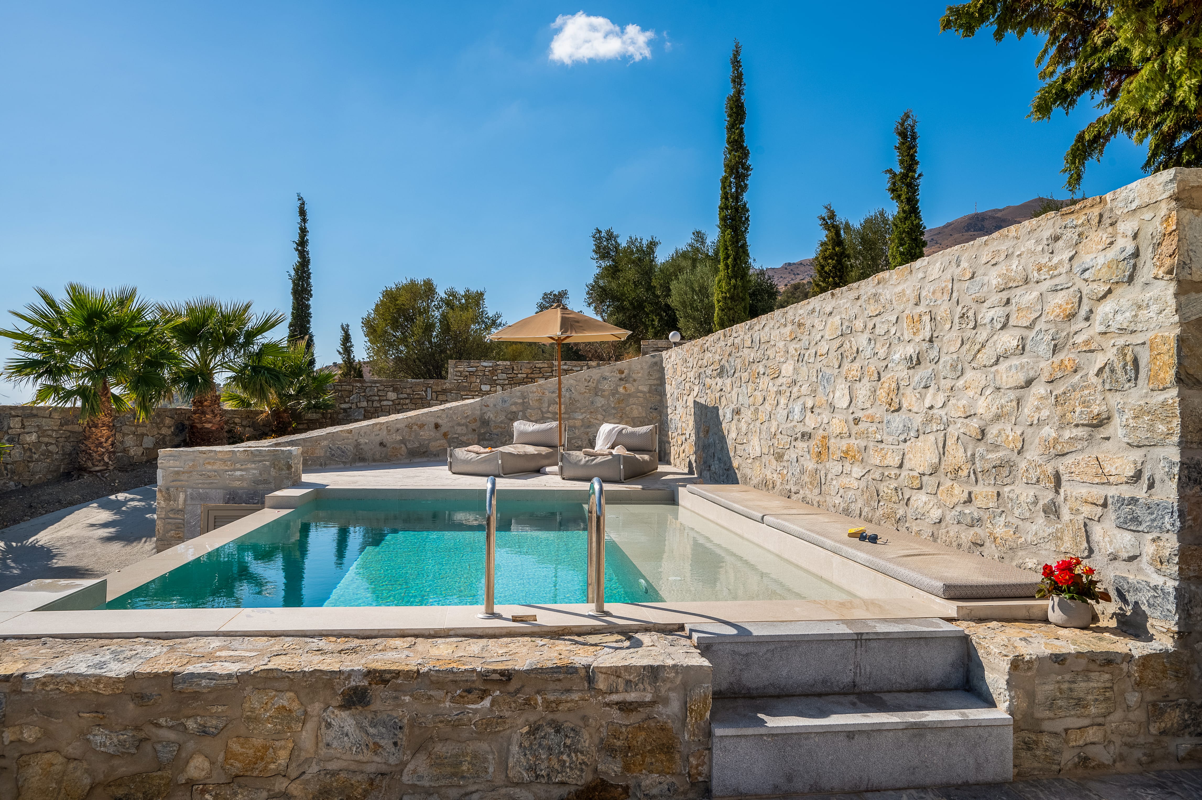 a pool in a stone wall