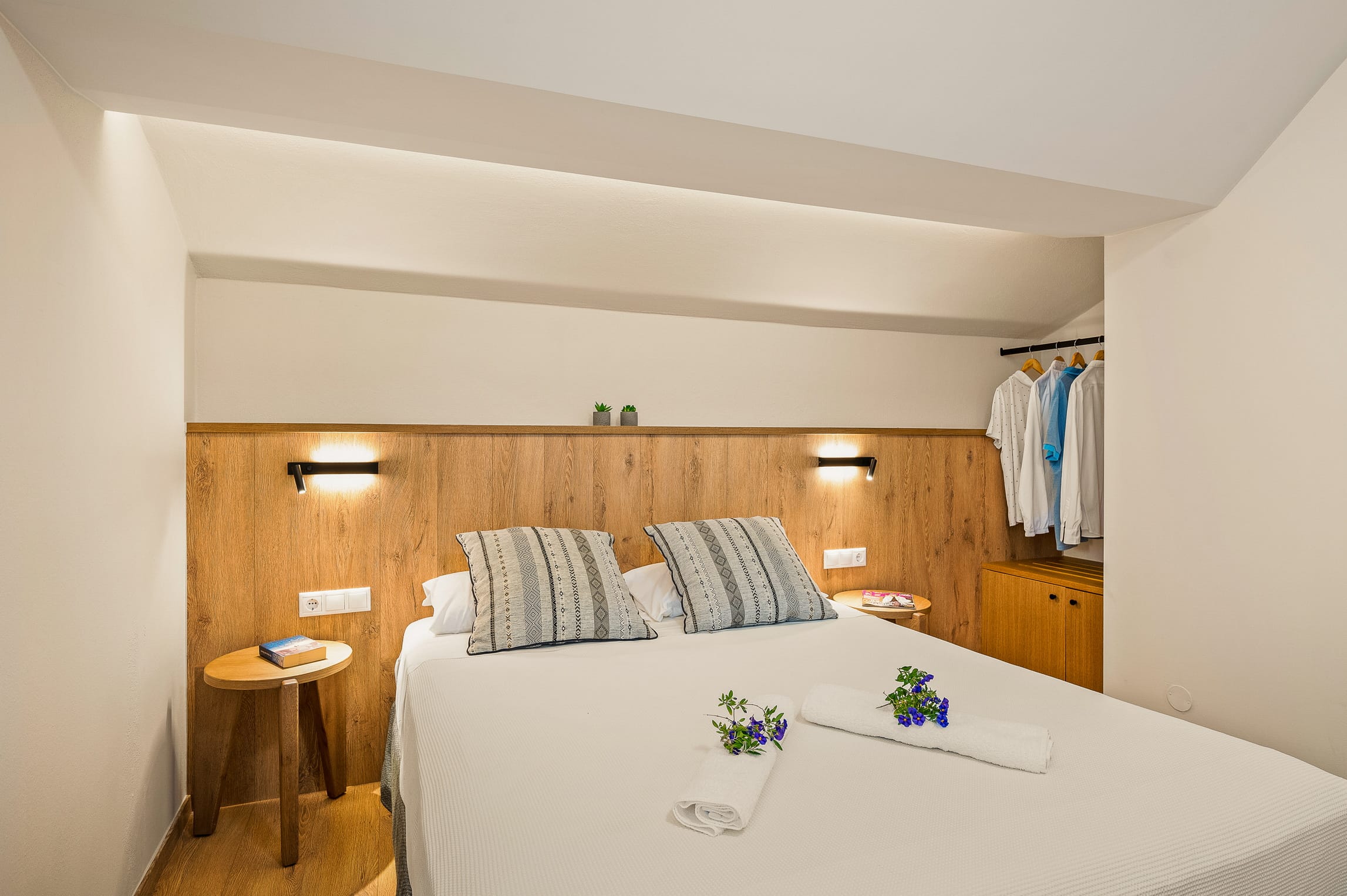 a bed with a table and chairs