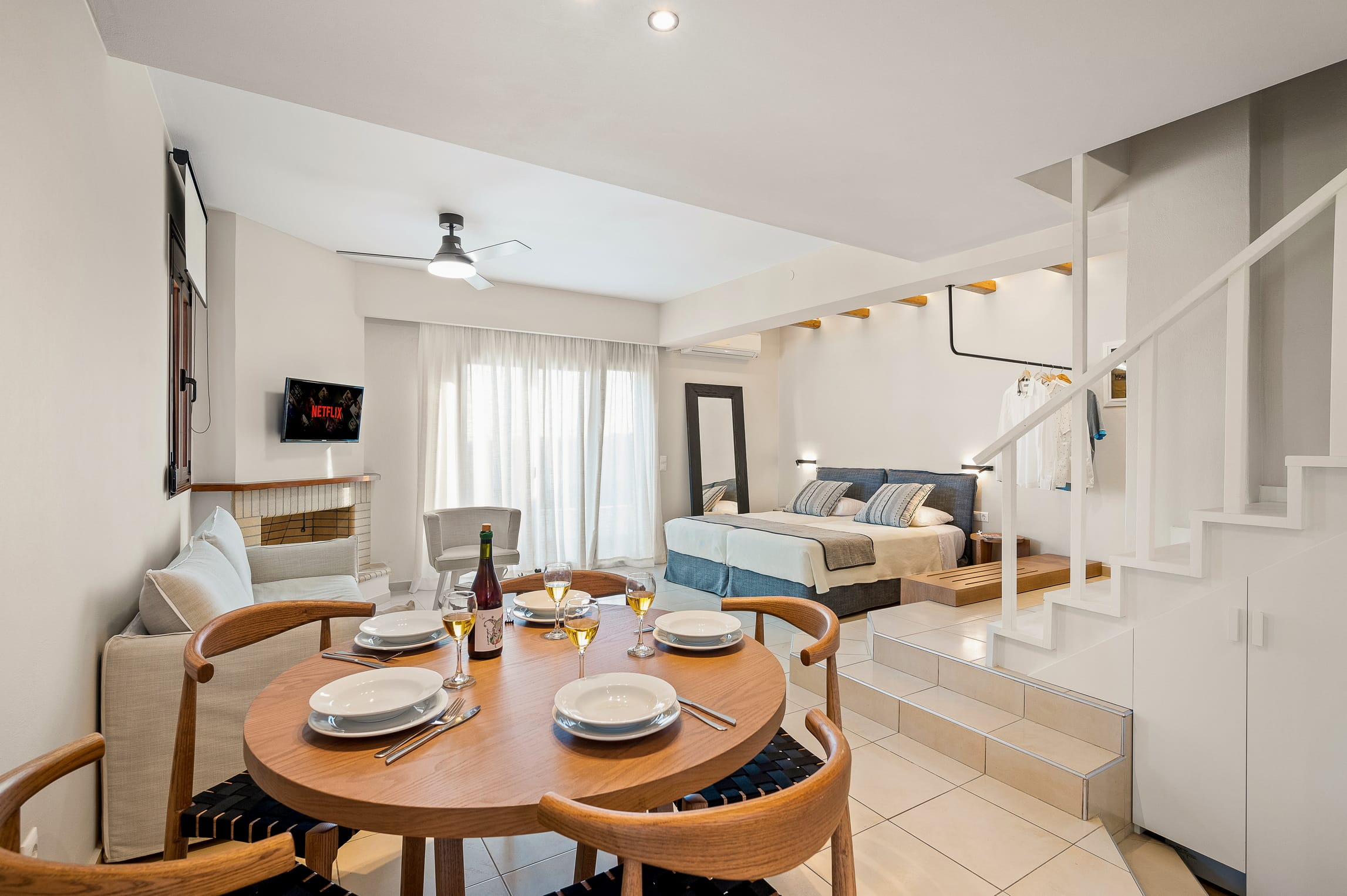 a dining room with a couch and a table