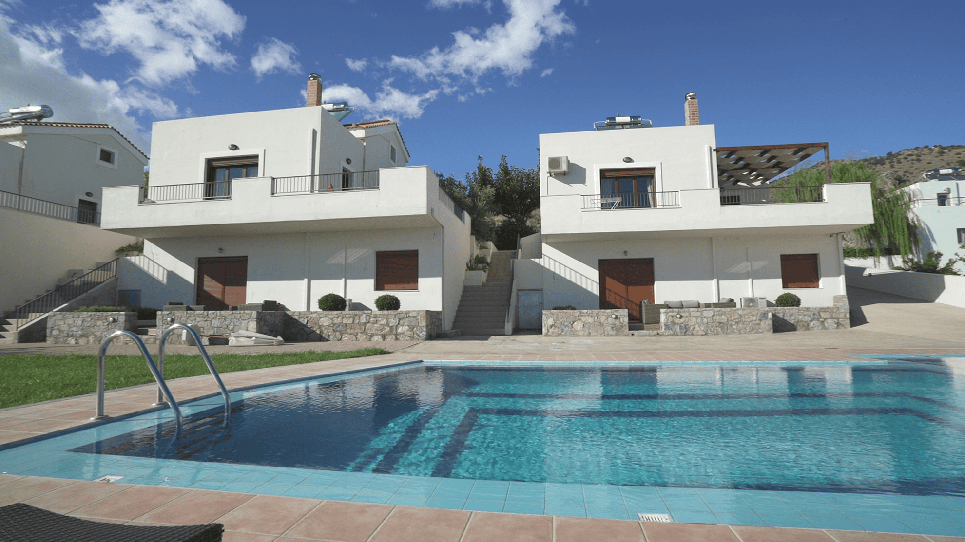 a pool in front of a house