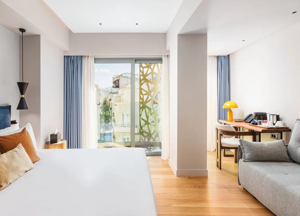 a bedroom with a large window