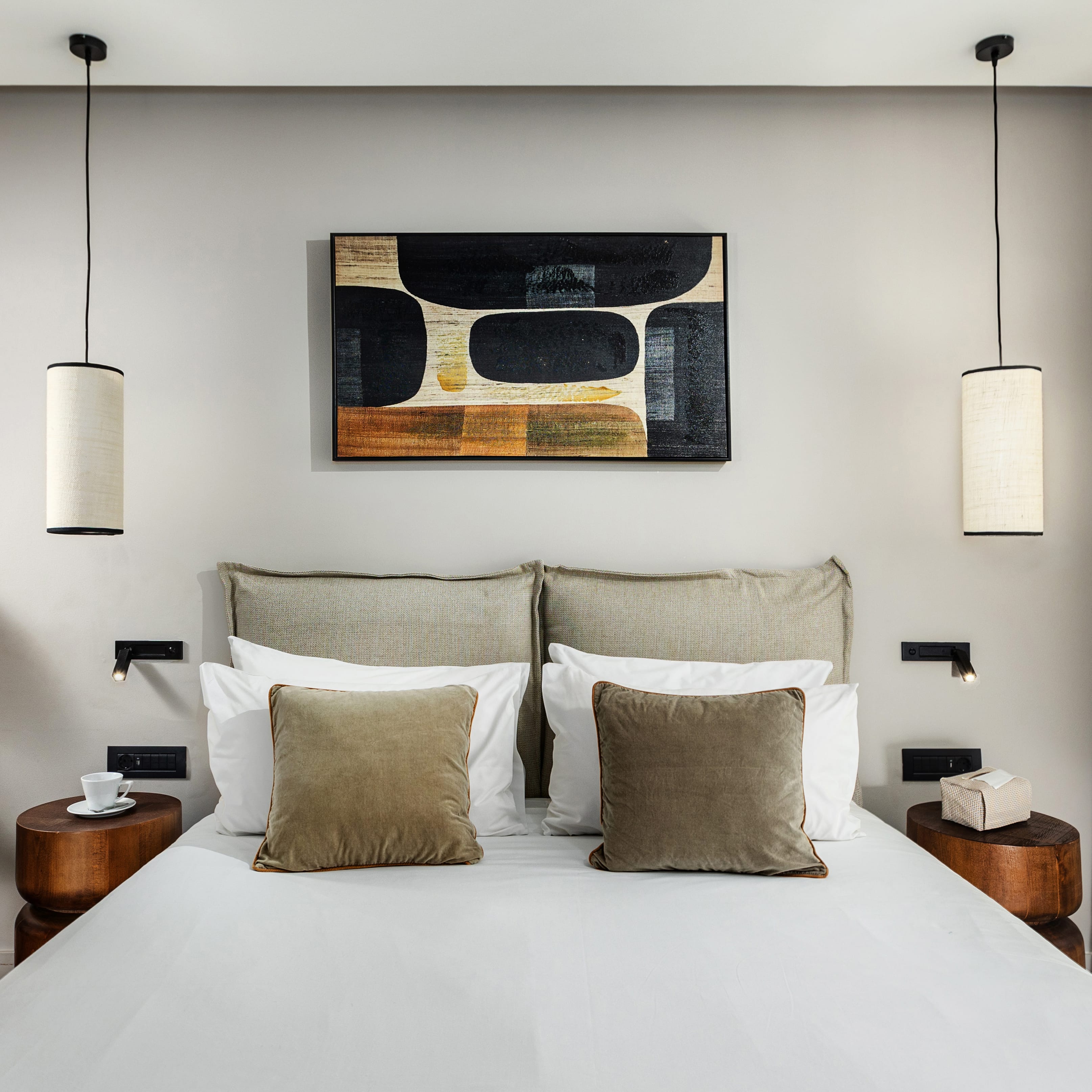 a bed with a picture on the wall