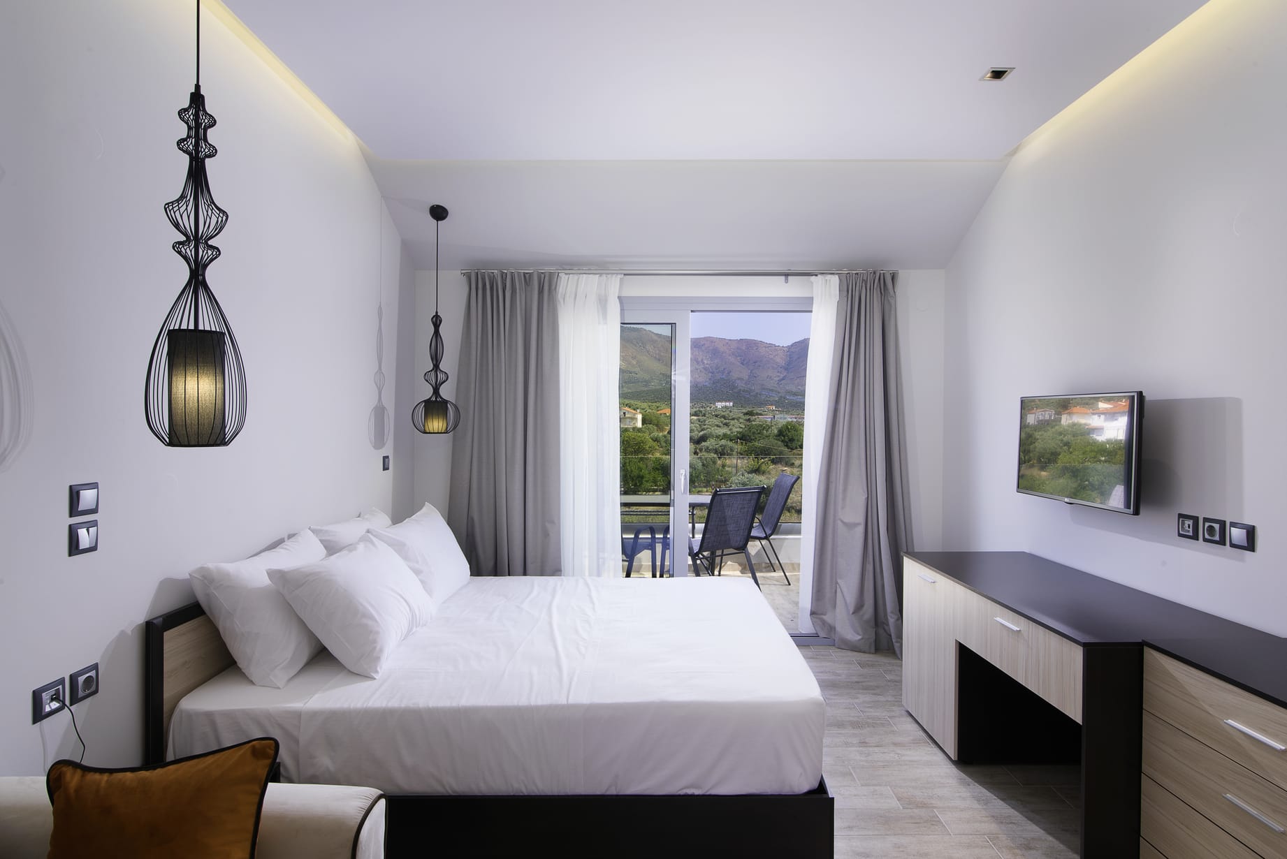 a bedroom with a large window