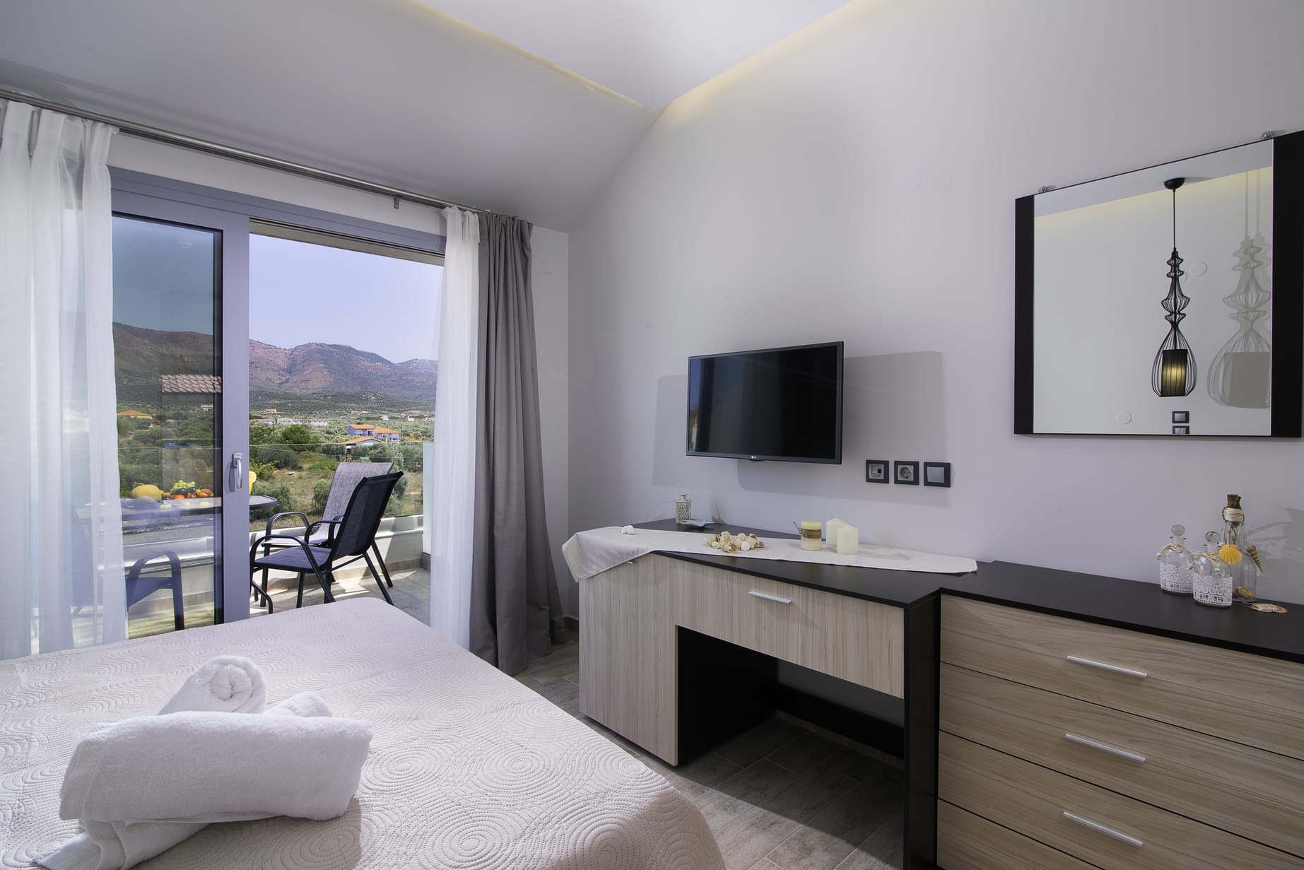 a bedroom with a large window