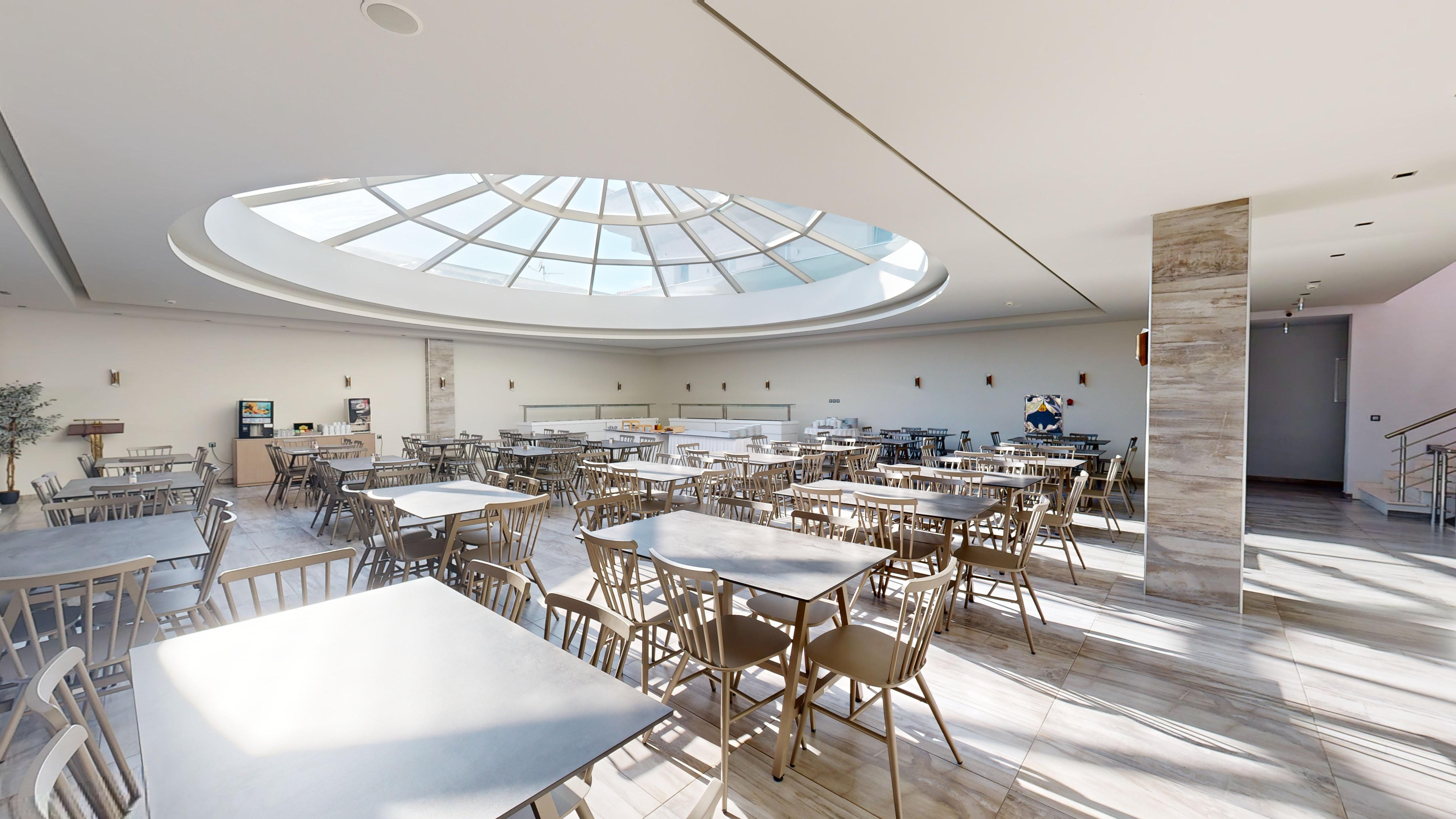 a room with tables and chairs