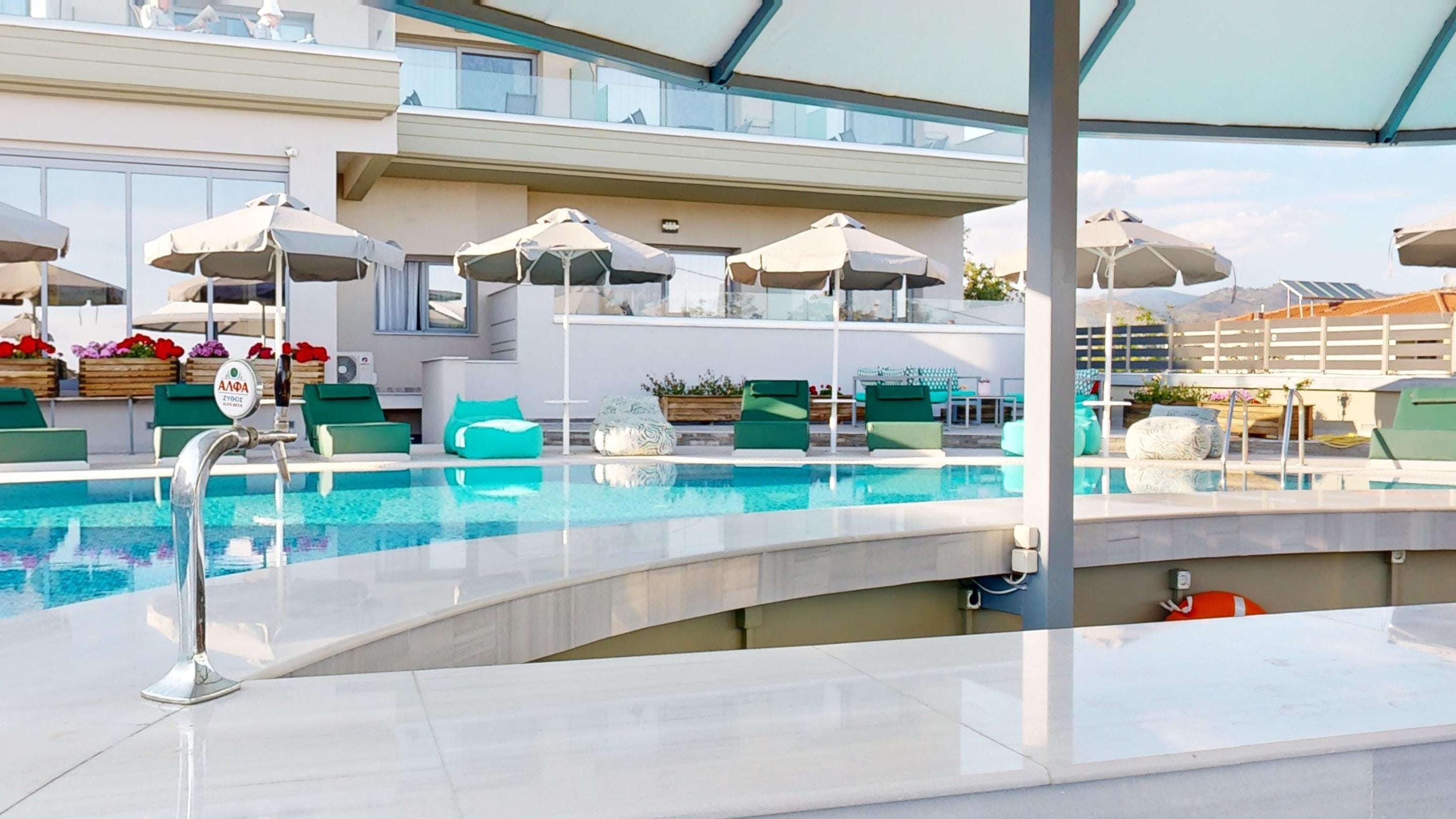 a pool with umbrellas and chairs