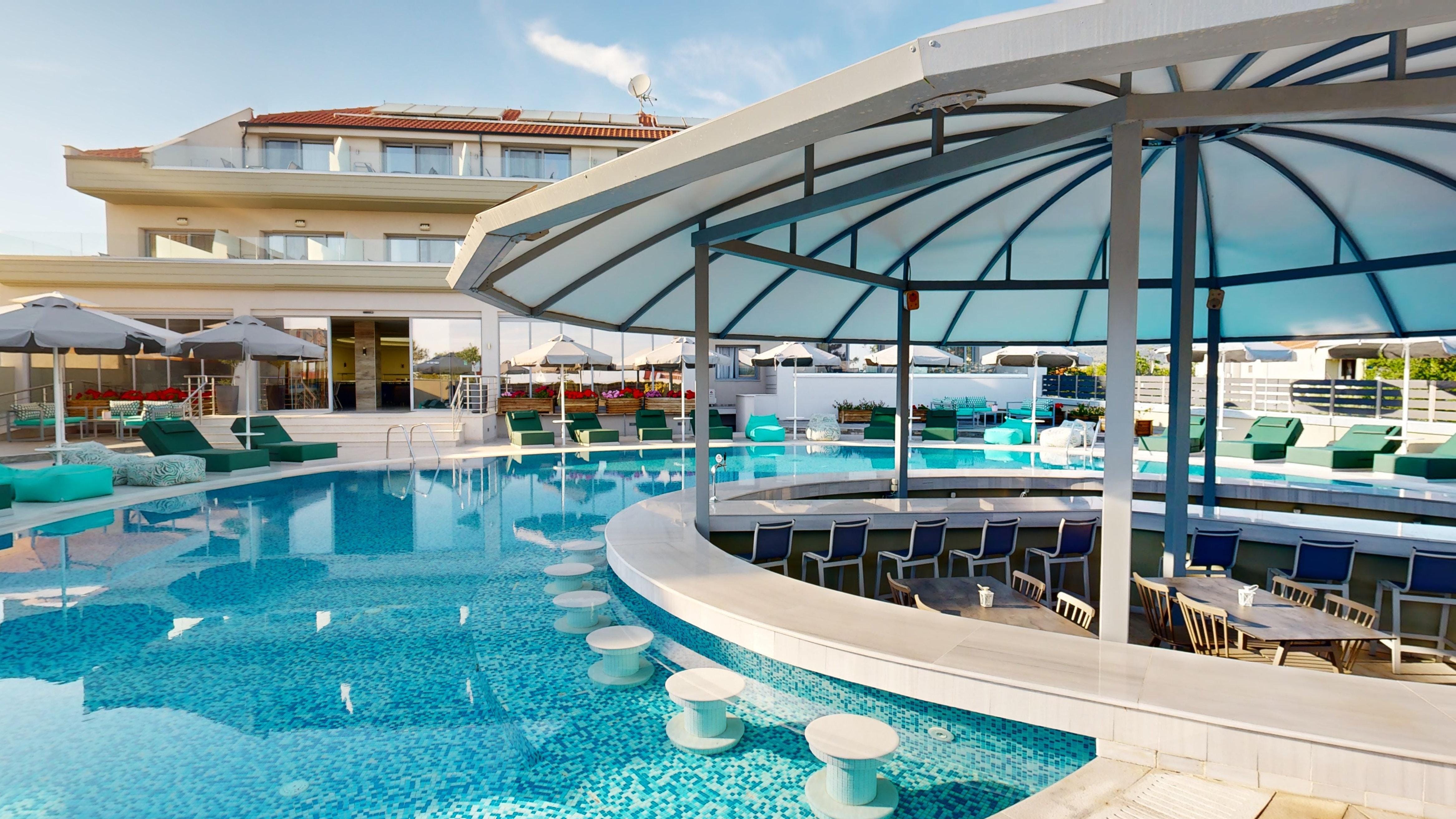 a swimming pool with a covered patio