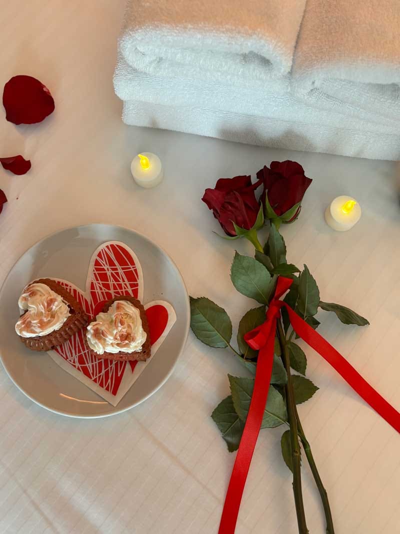 a plate of food and a bowl of fruit on a table