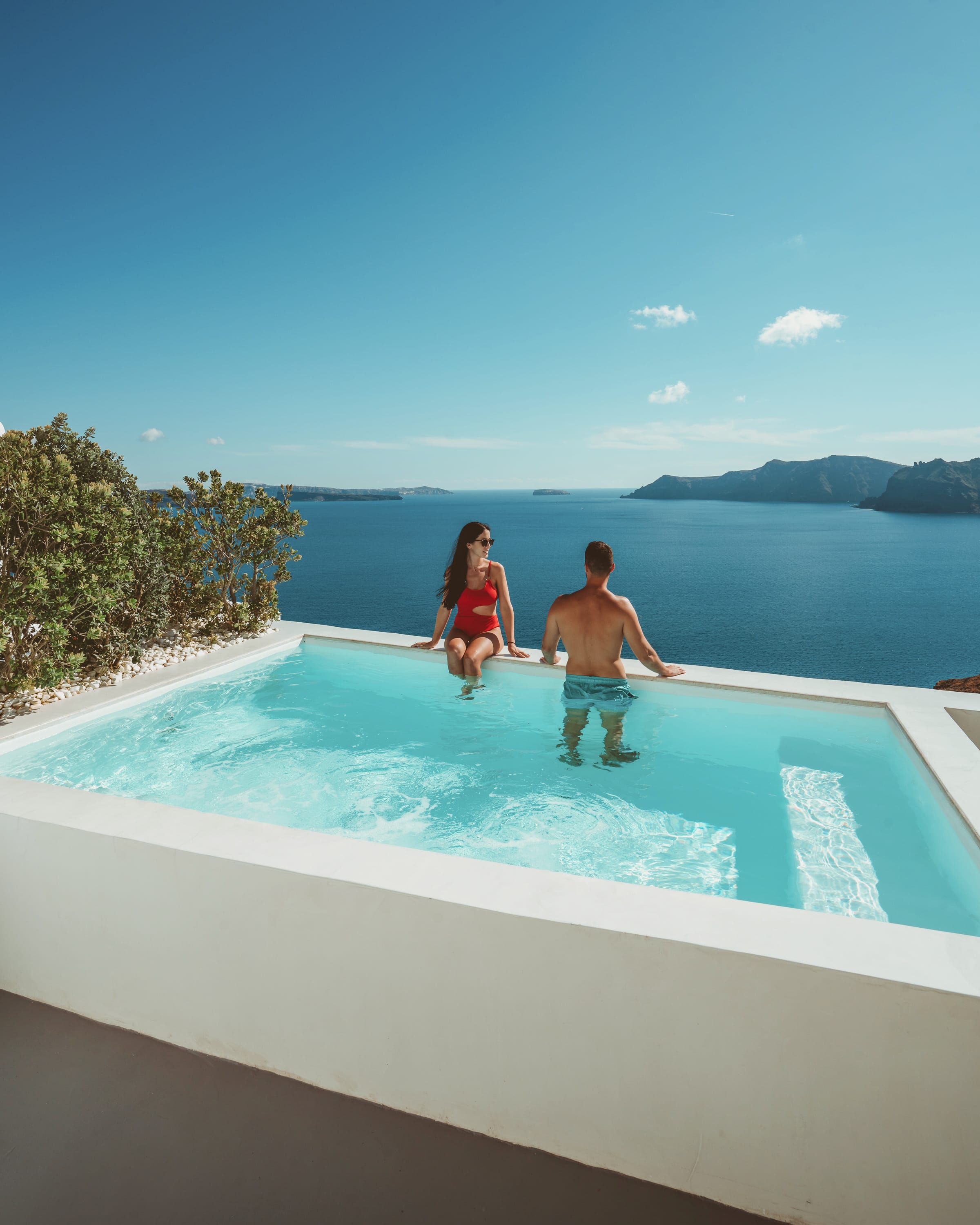 a man and woman in a pool