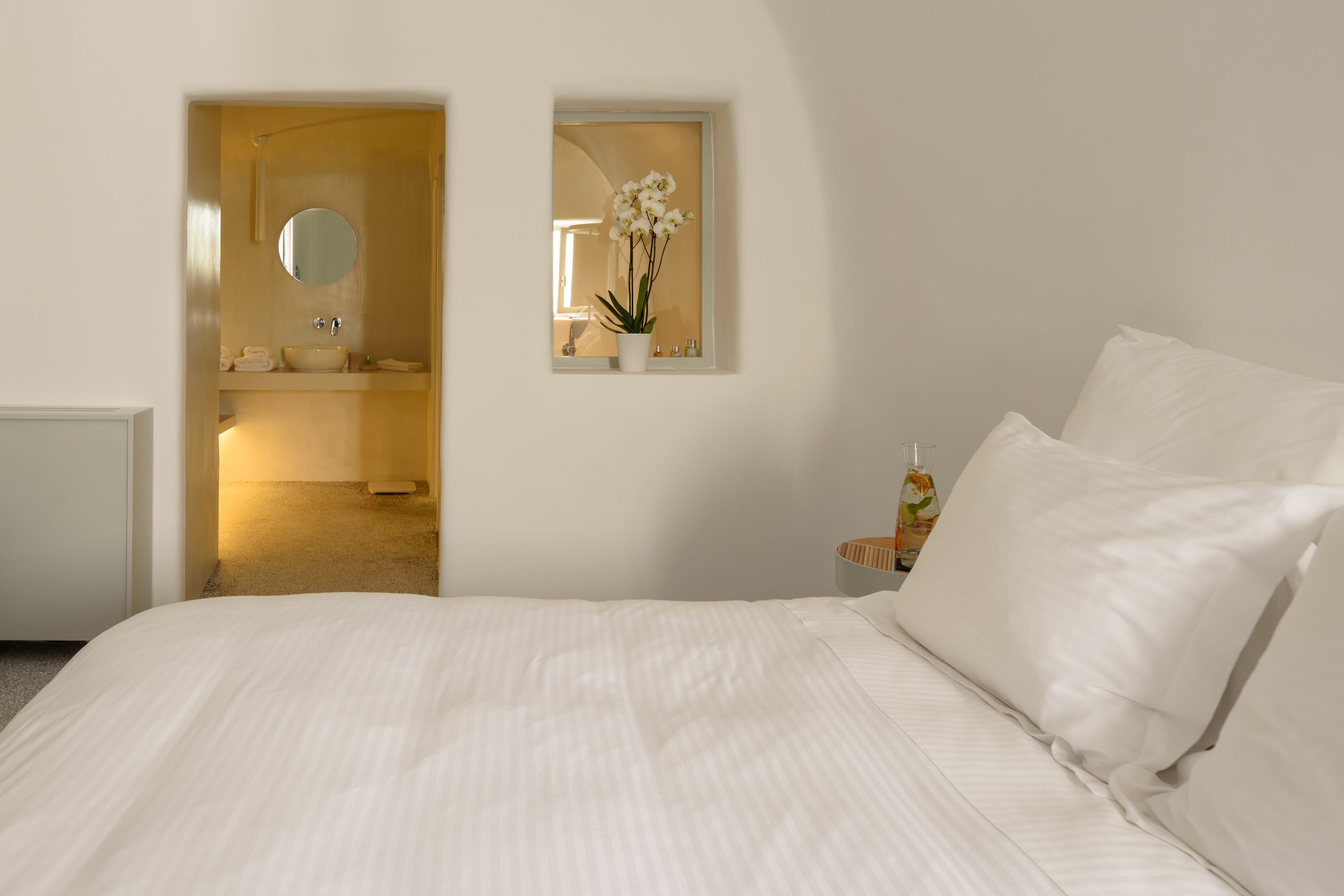 a bed with white sheets