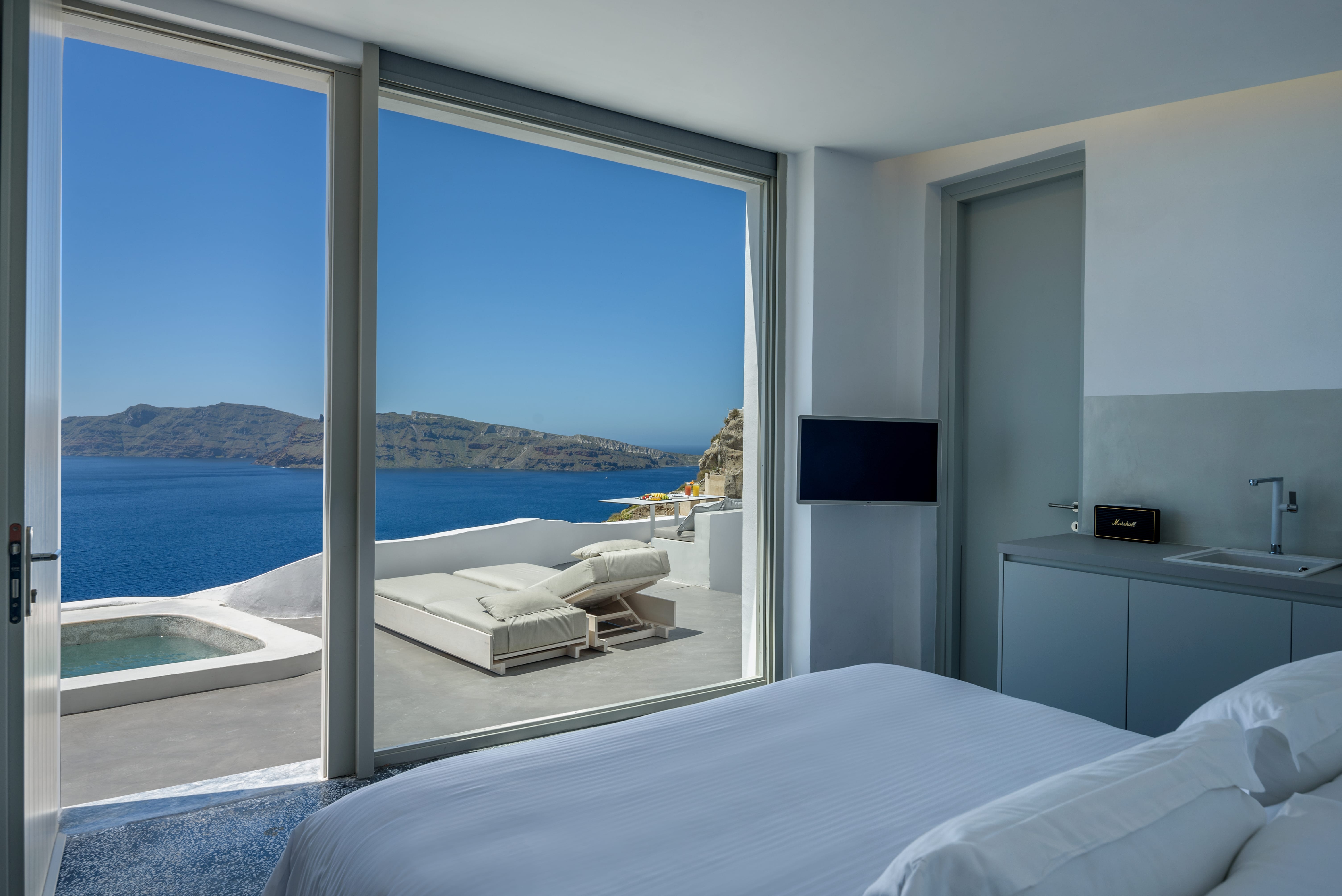 a bedroom with a large window