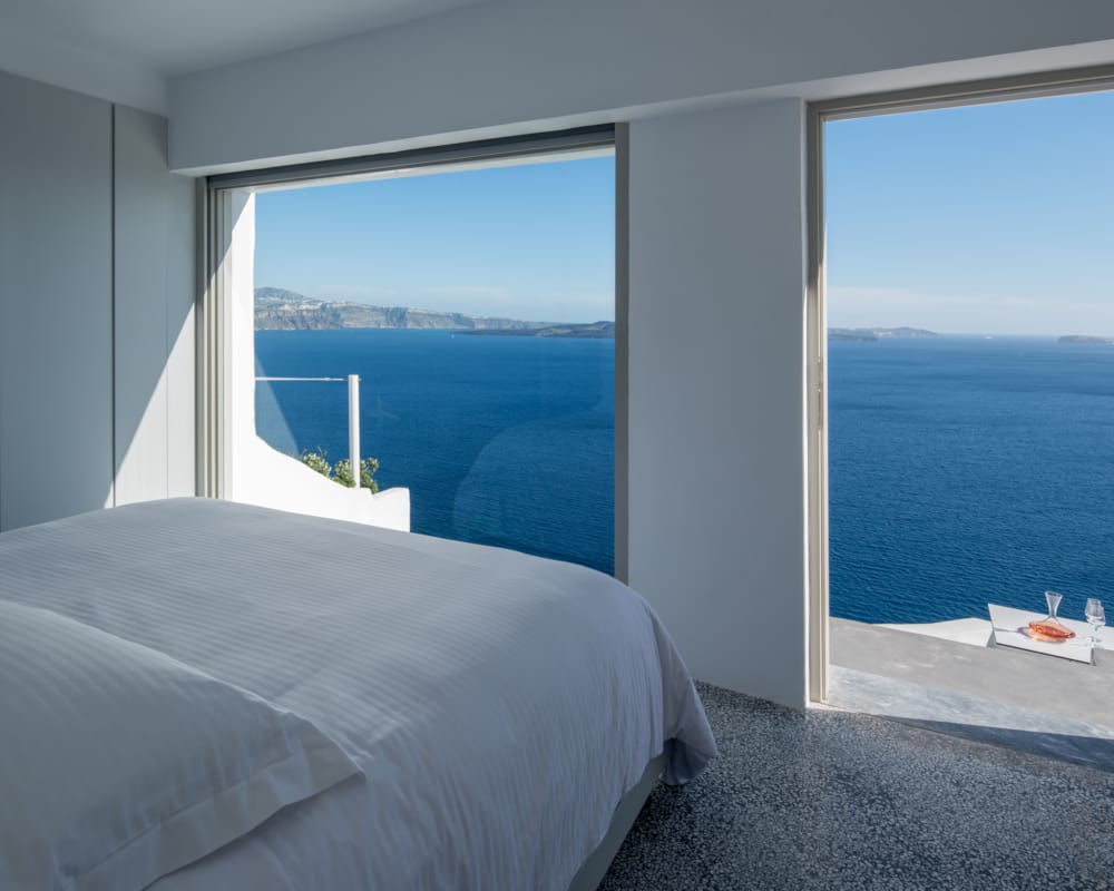 a bed next to a window