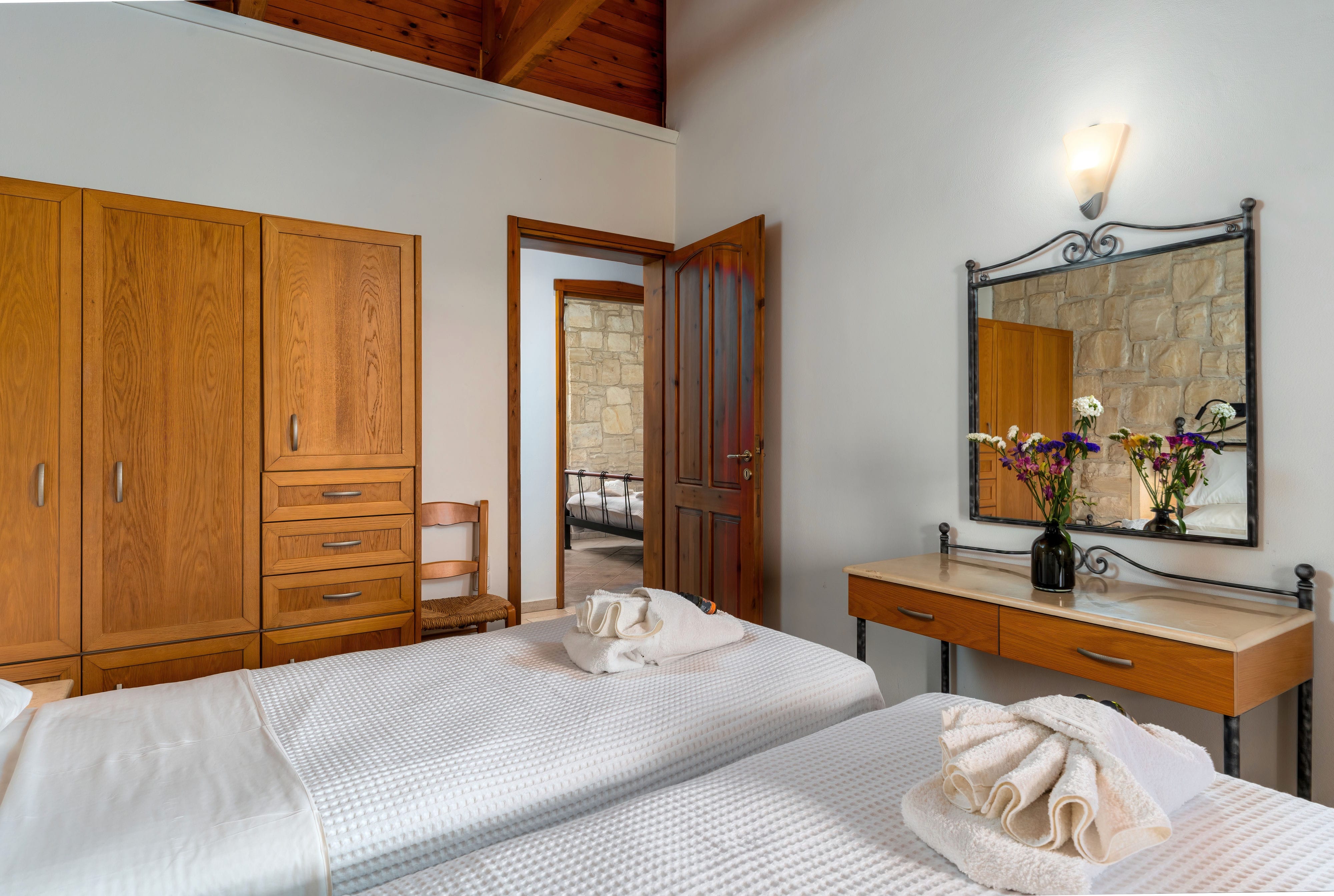 a bedroom with a mirror and a bed