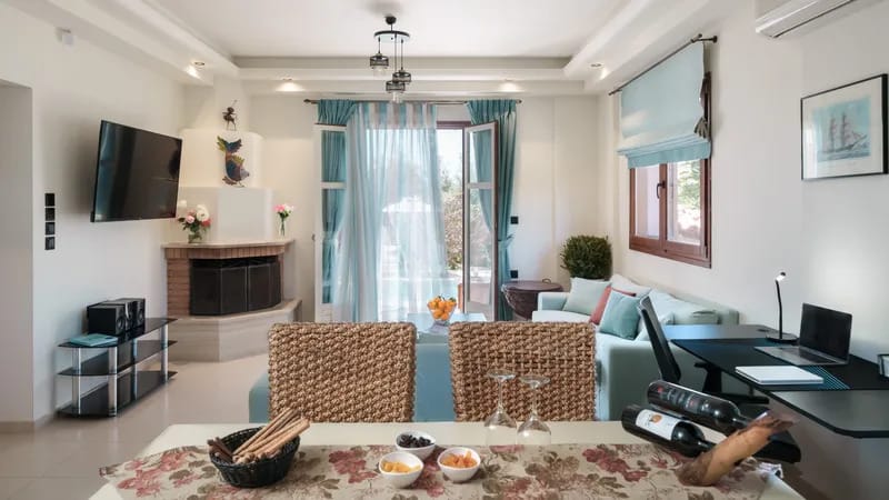 a living room with a table and chairs