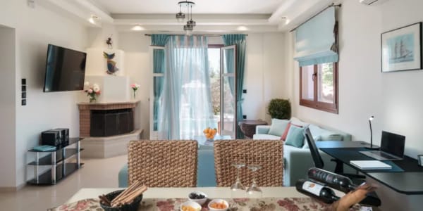 a living room with a table and chairs