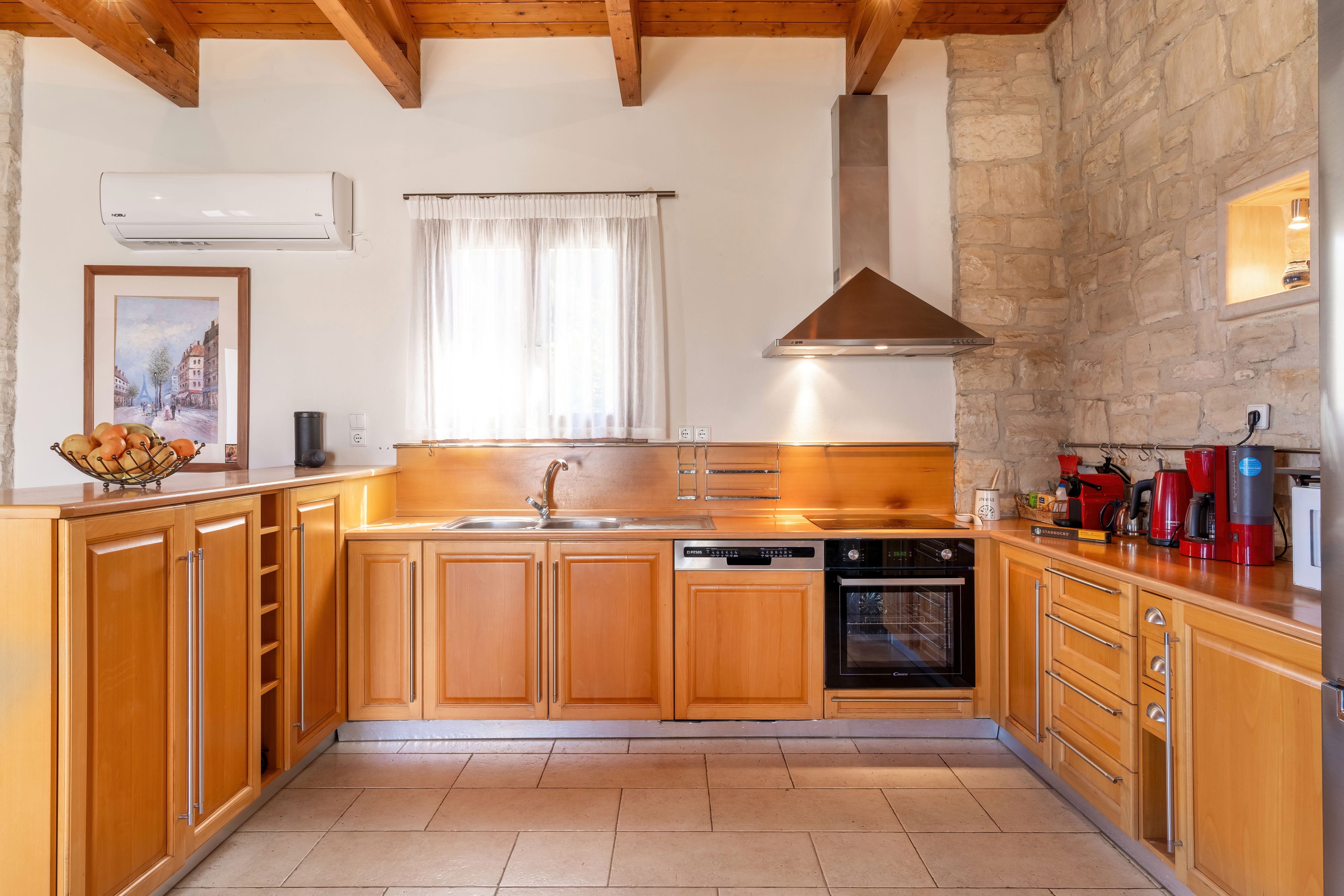 a kitchen with wooden cabinets