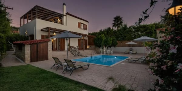 a backyard with a pool and a house