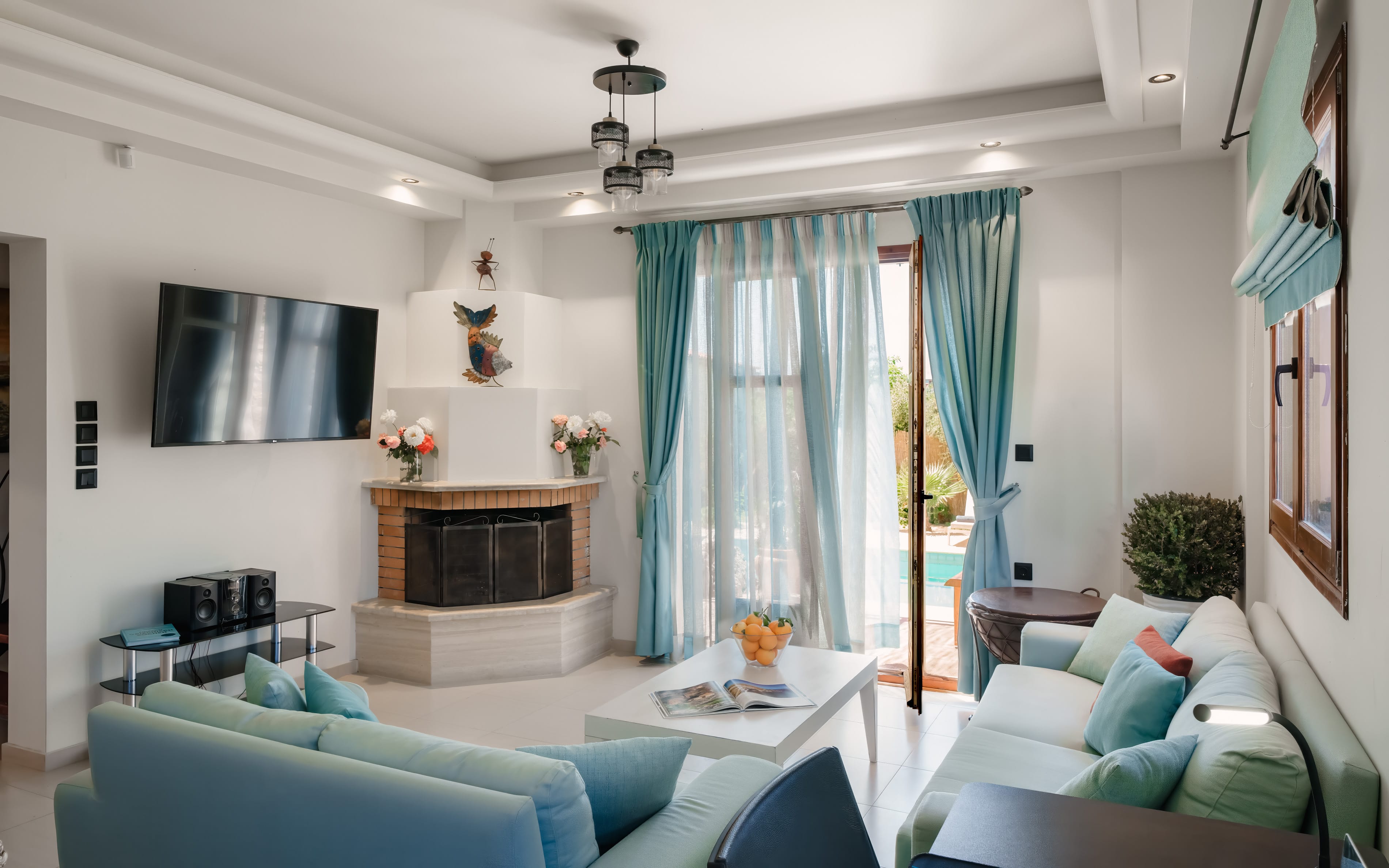 a living room with blue curtains