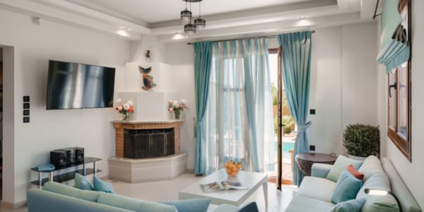 a living room with blue curtains