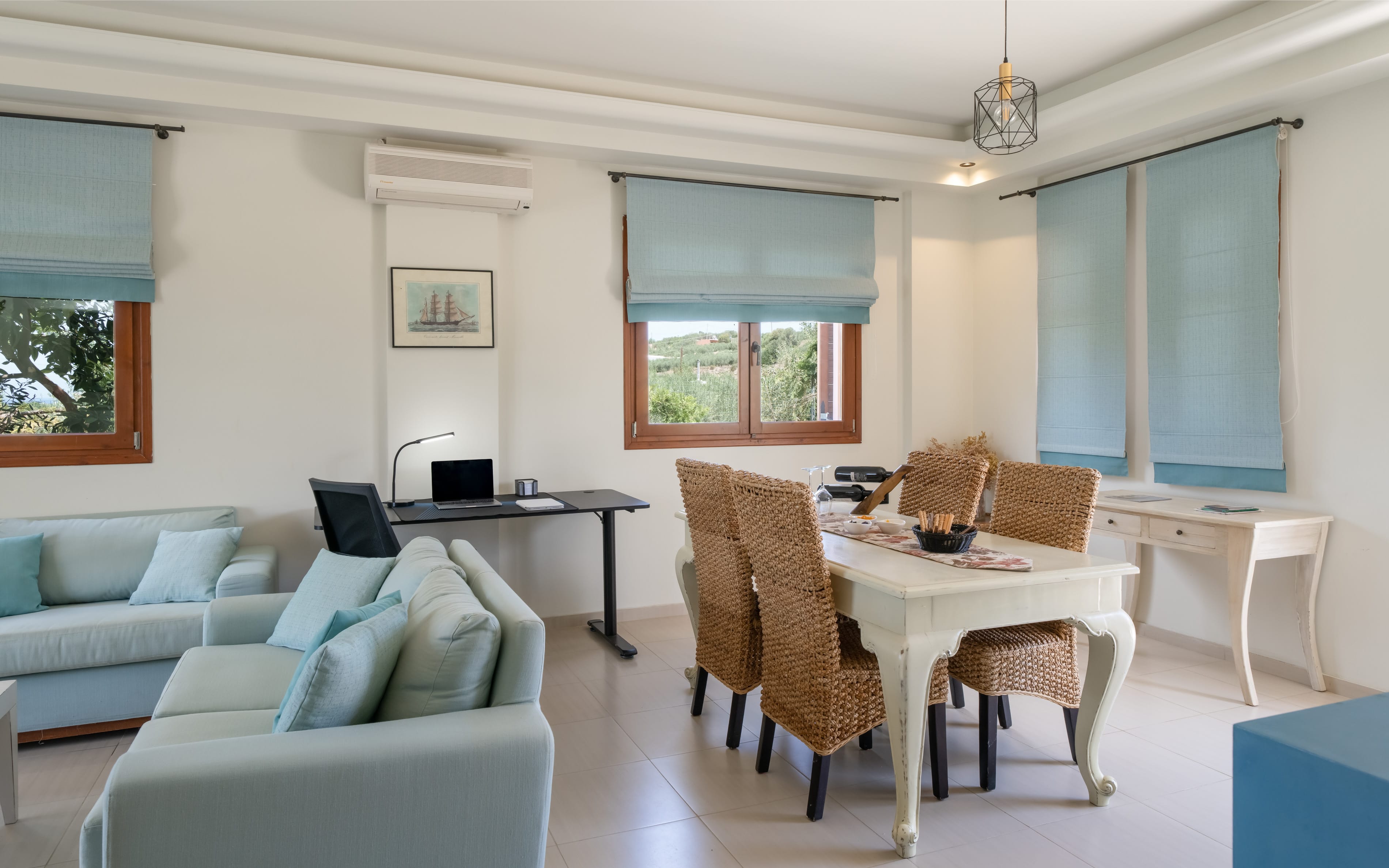 a living room with a table and chairs