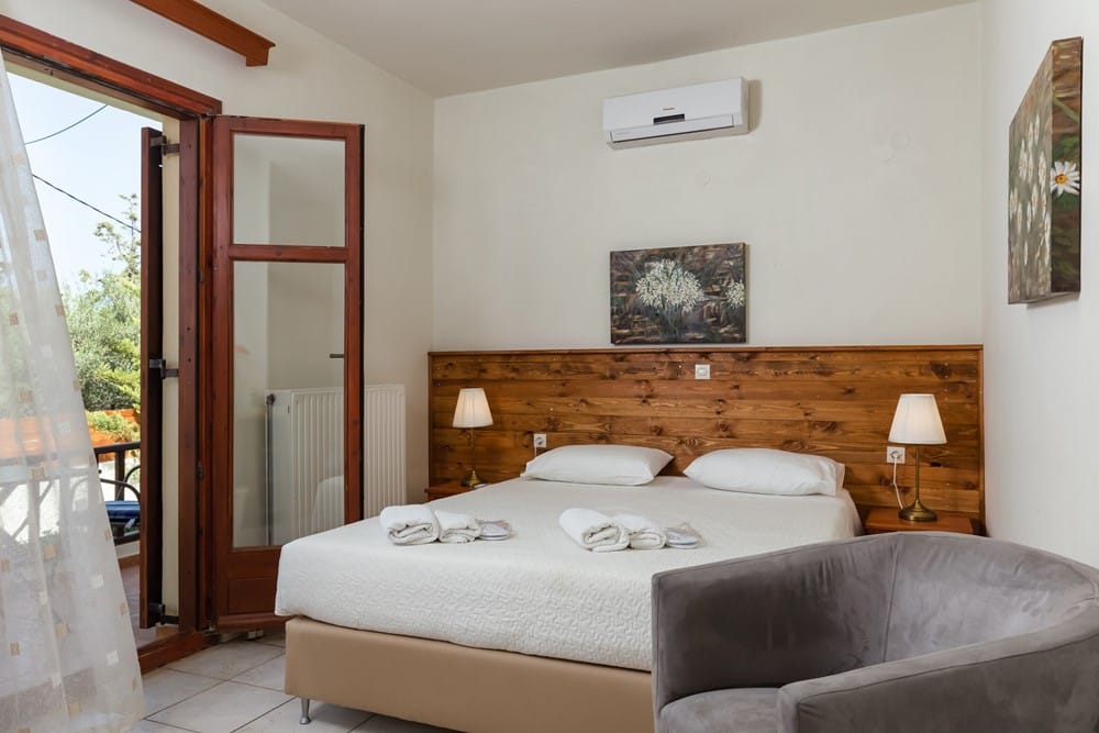 a bedroom with a bed and a couch