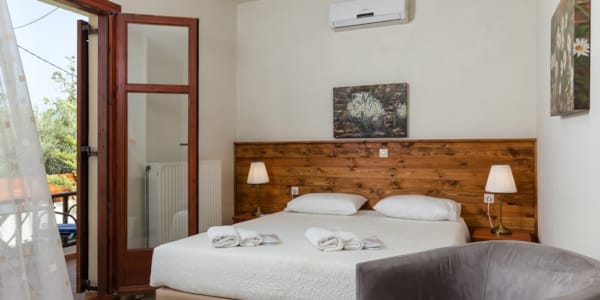 a bedroom with a bed and a couch