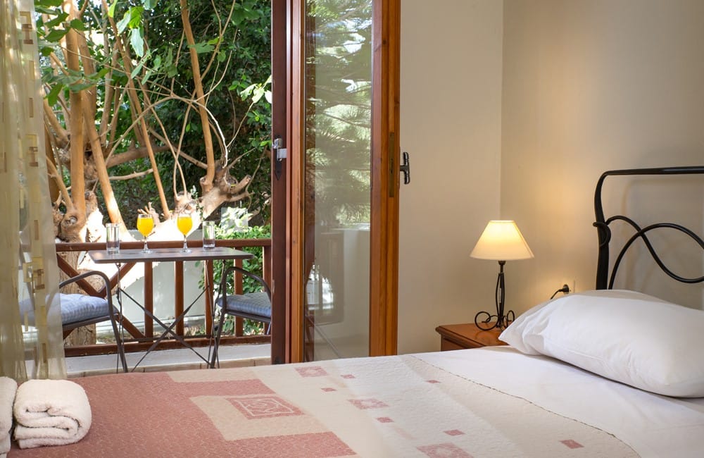 a bed with a table and lamp