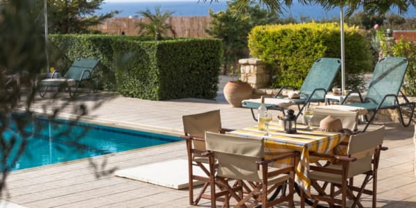 a table and chairs on a deck