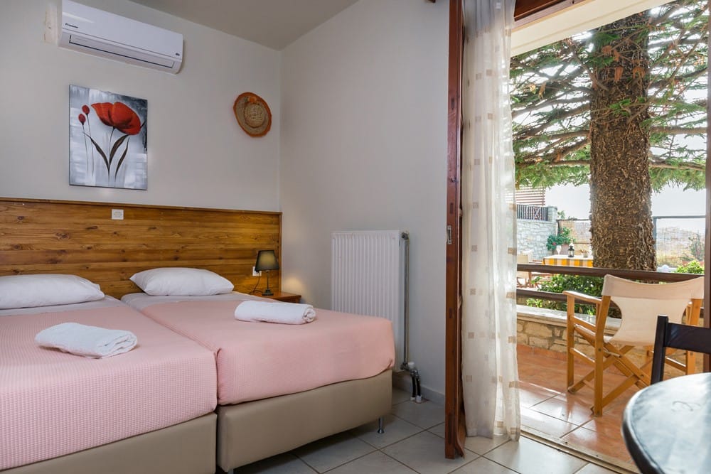 a bedroom with a large window