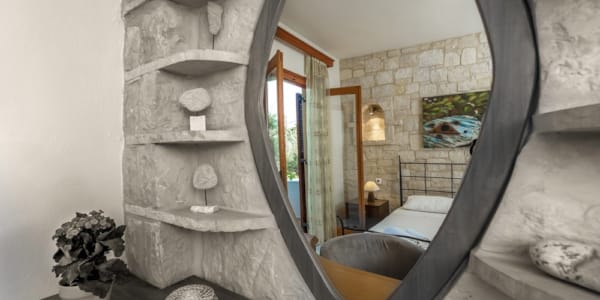 a room with a mirror and a fireplace