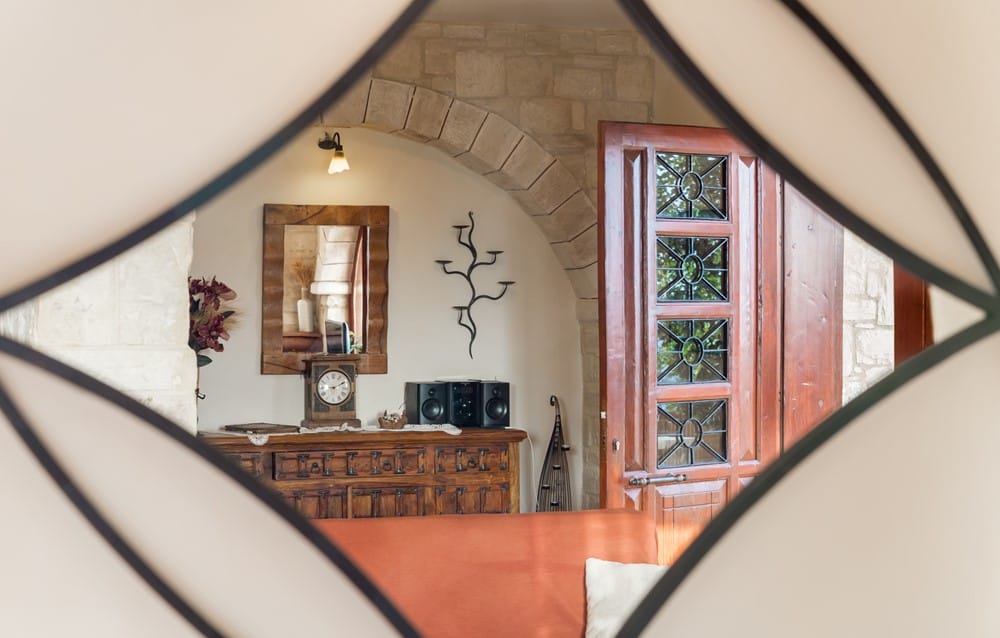 a room with a clock and a mirror