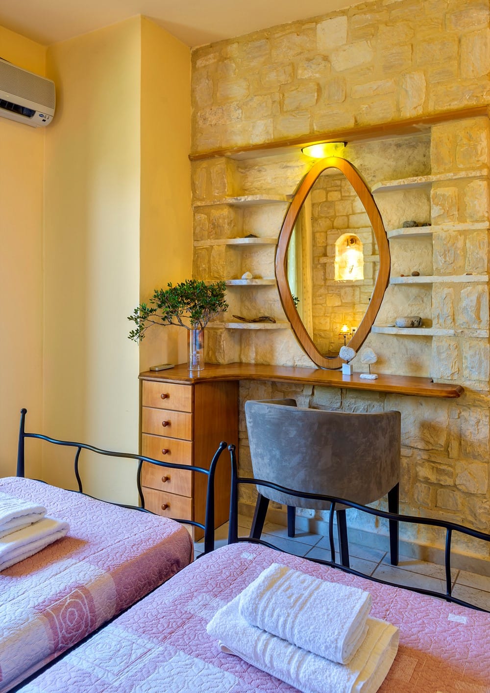 a bedroom with a mirror and a bed