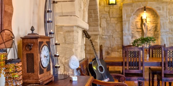 a guitar leaning against a table