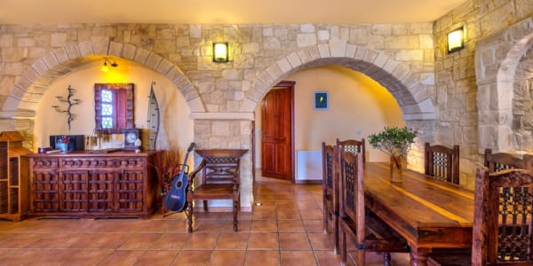 a large room with a few tables and chairs