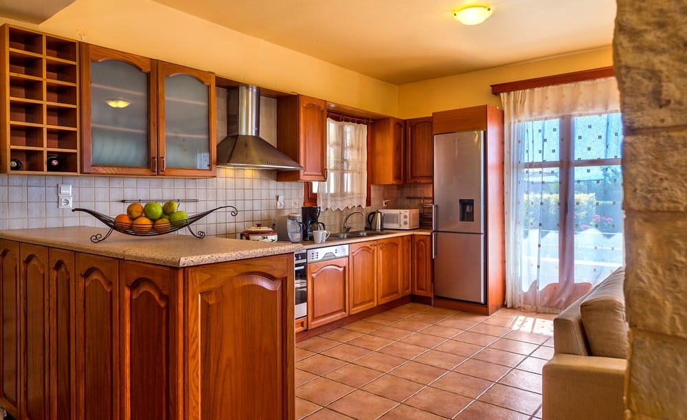 a kitchen with a tile floor